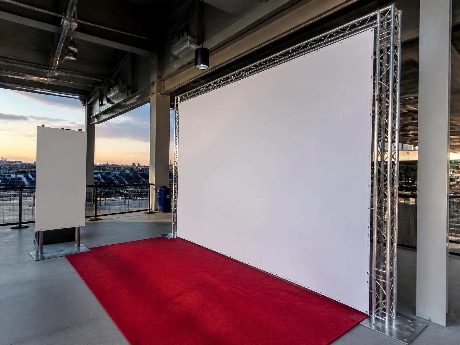 Event media wall and signage installed in a stadium concourse before doors open